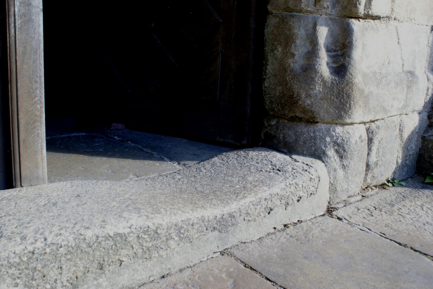 Eroded step at the entrance of St Malo's Church, Dinan