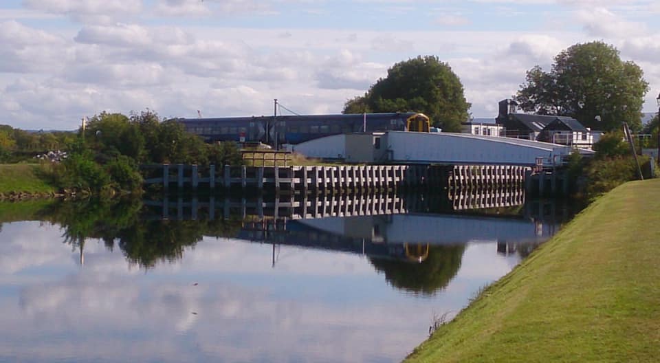 train crossing the canal on the swing bridge at Clachnaharry in Inverness