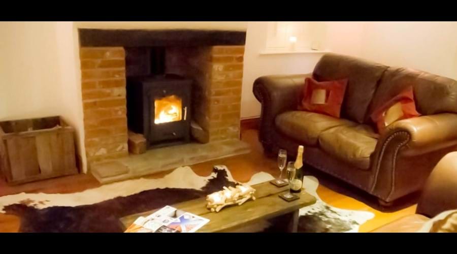 Benbow Cottage lounge with reclaimed wood flooring