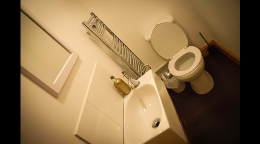 Downstairs cloakroom with heated towel rail