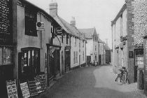 Blakeney High Street including The Ship Inn in the 19th century