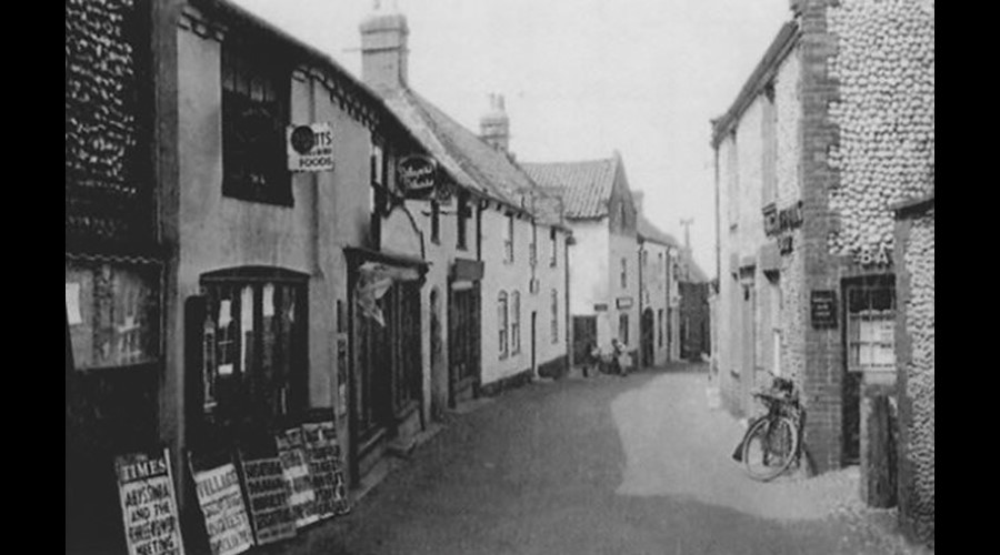 Blakeney High Street including The Ship Inn in the 19th century