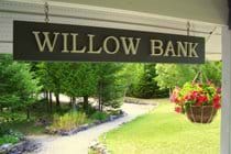 The Willow Bank sign by the rear entrance welcomes visitors to the cottage.