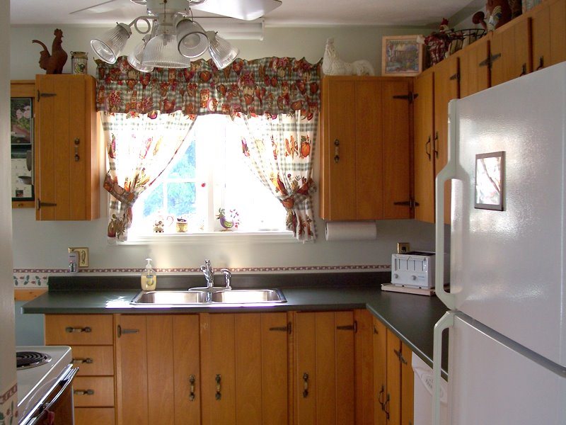 The kitchen is light and bright and located just a few steps from the dining room.