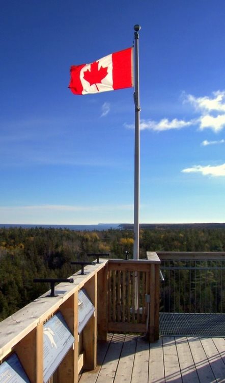 The Canadian flag flies proudly a top the observation tower at the National Park visitor