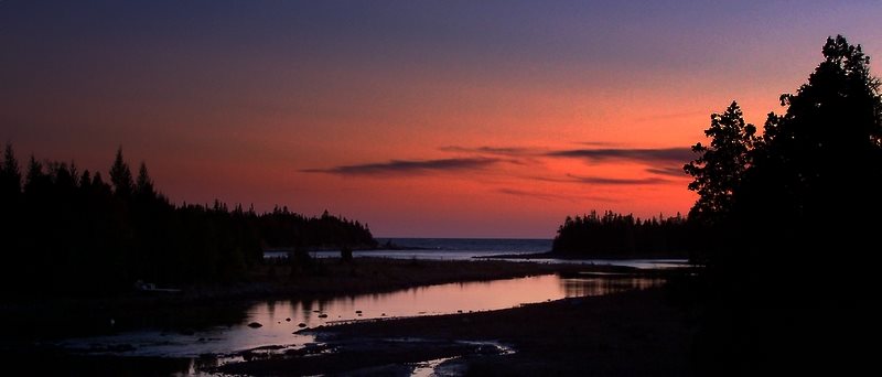 As the sun sets and day-light fades, the sky turns from blue to red.