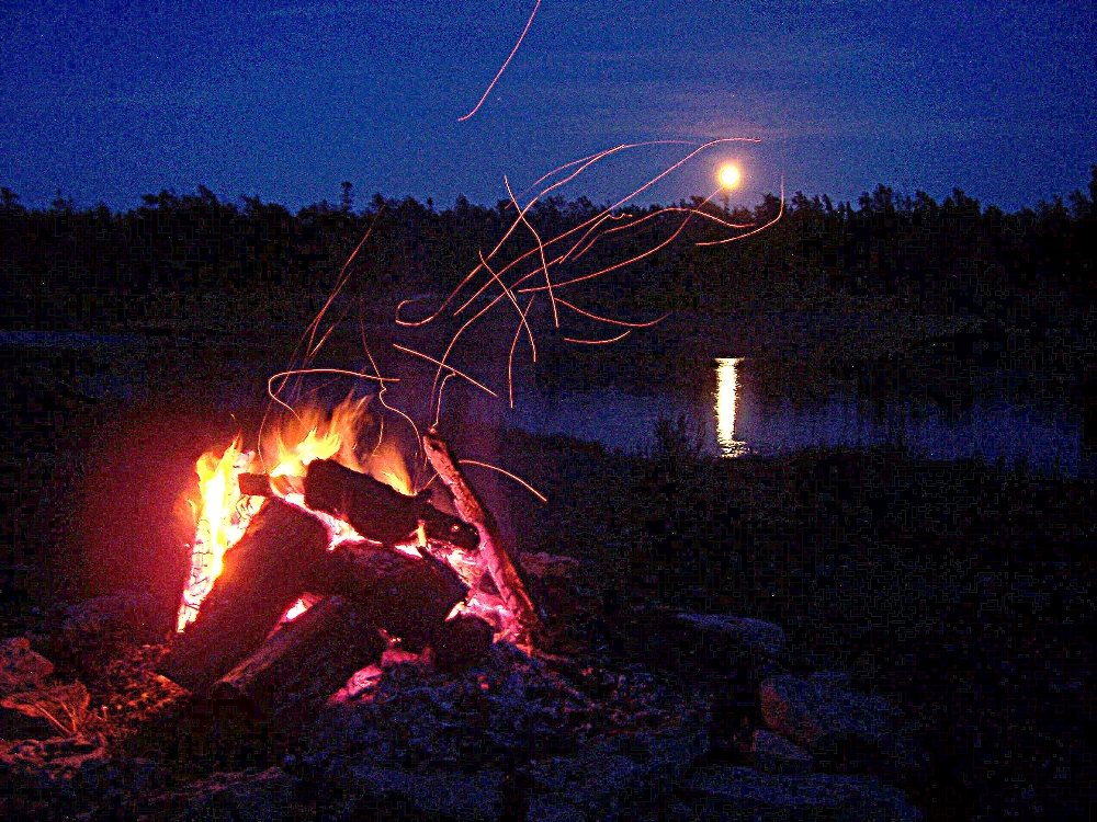 Watching the rising moon while sitting around the camp-fire can be a romantic way to spend an evening at the cottage.