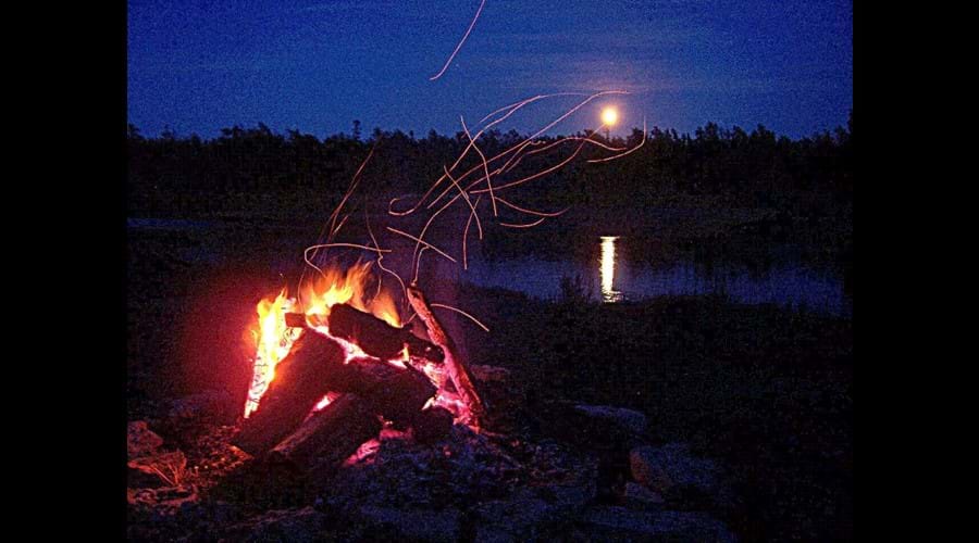 Watching the rising moon while sitting around the camp-fire can be a romantic way to spend an evening at the cottage.