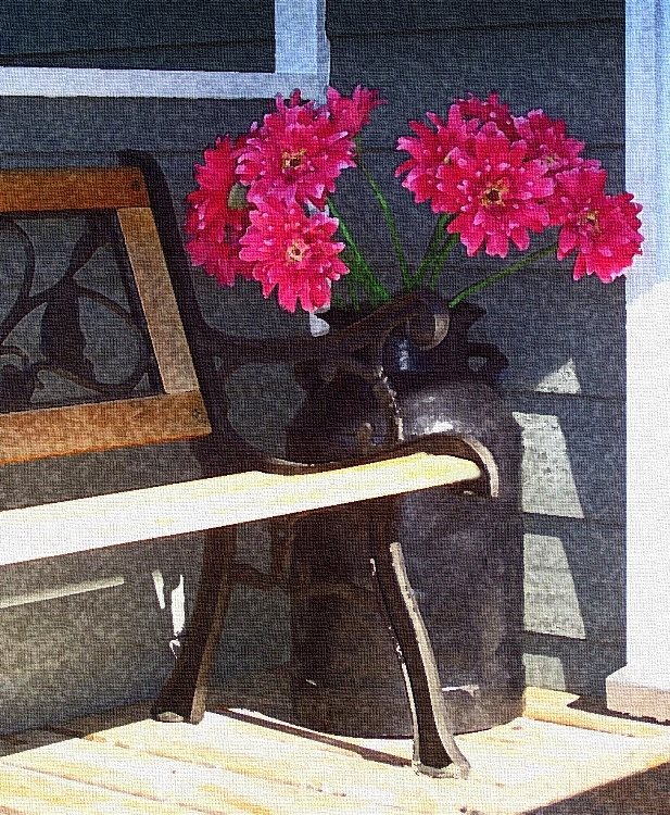 The covered back porch is a nice place to sit in the shade and relax. 