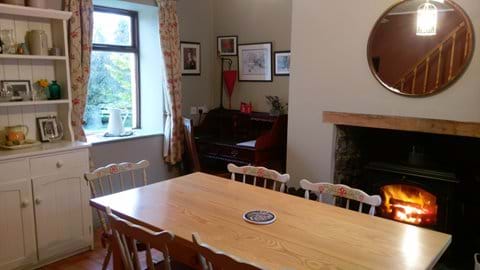 Dining room with views to the front garden and farm buildings to the rear.
