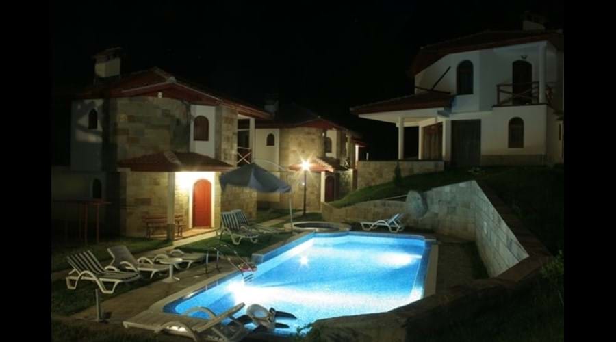 The pool looks pretty at night at our family chalet accommodation
