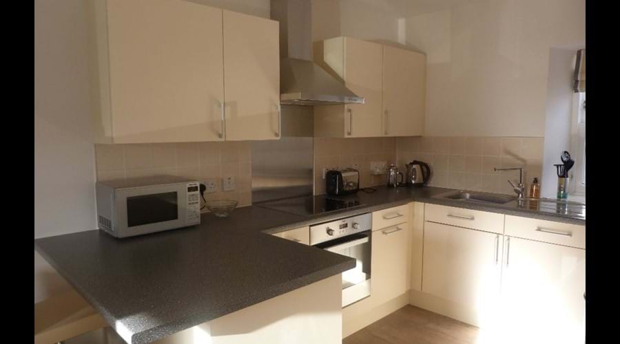 Fully equipped kitchen with integrated appliances