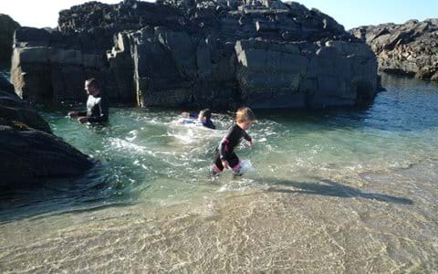 Swimming in the rock-pools at Saligo