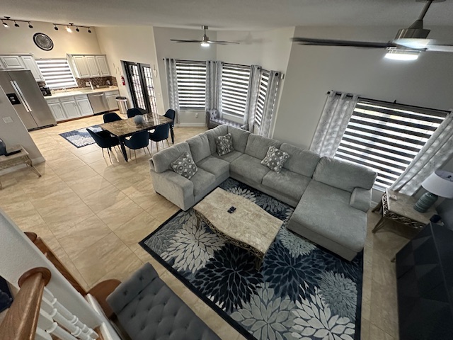 view of open space living from stairs