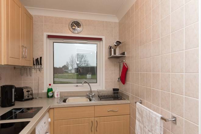 Modern fully equipped kitchen with washing machine
