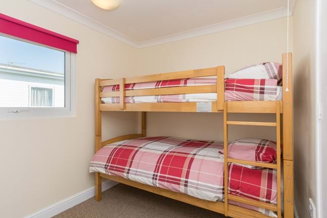 Spacious second bedroom with full size bunk beds