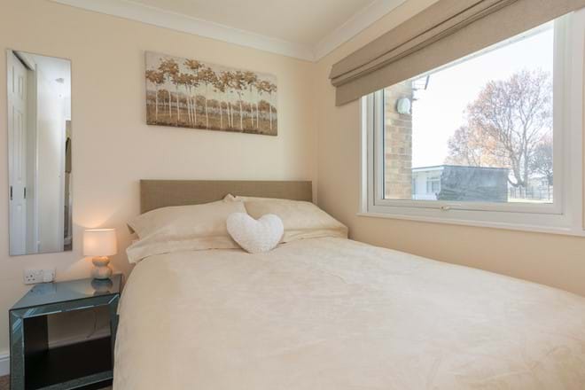 Comfortable double master bedroom with fitted double wardrobe, full length mirrror and stylish glass side table