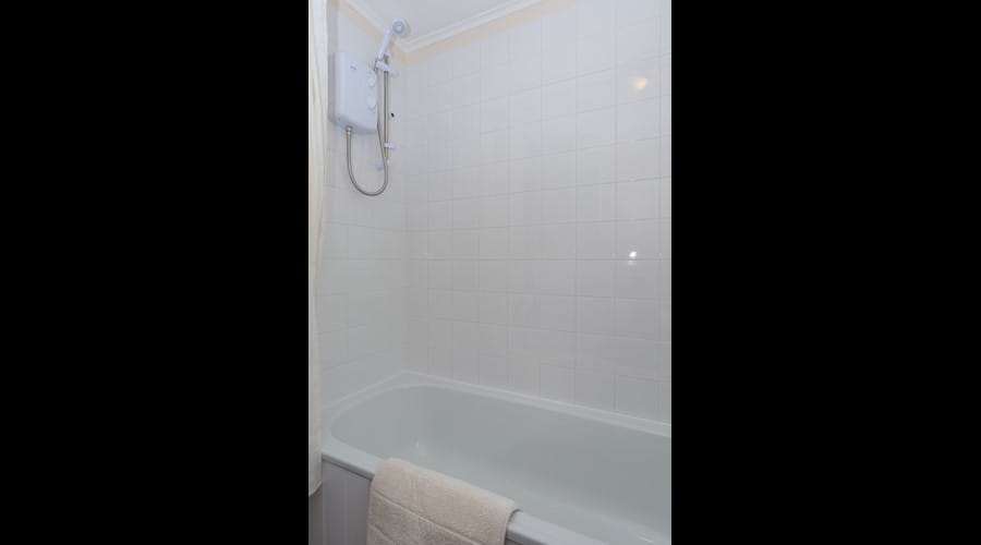 Electric shower over bath