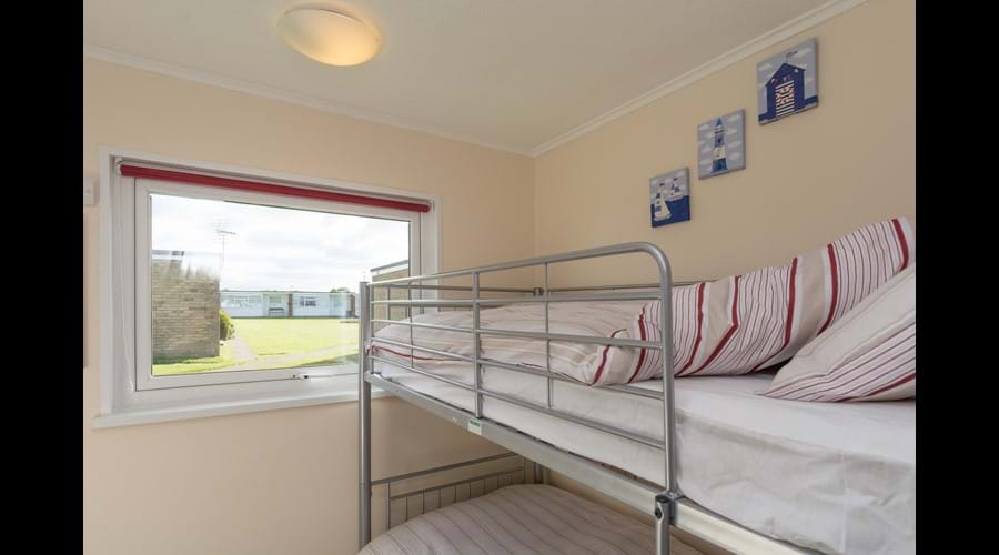 Second bedroom with space for cot or ready bed with fitted wardrobe