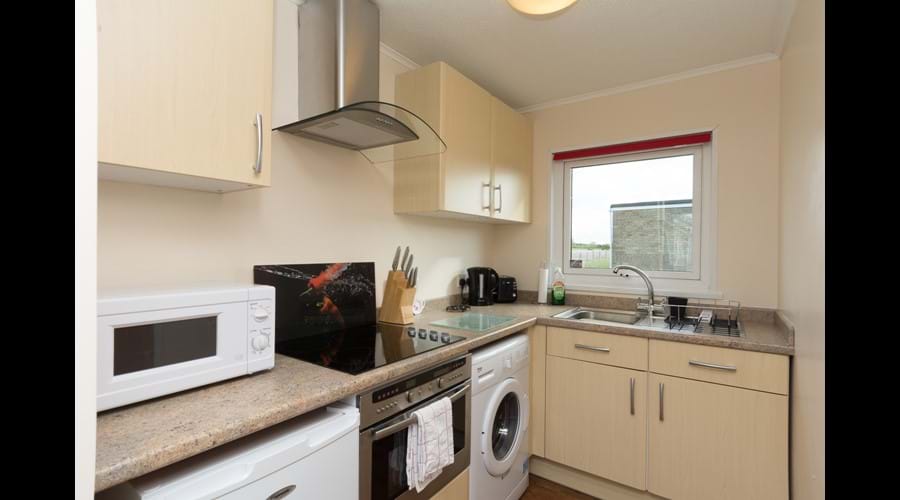 Fully equipped modern kitchen with washing machine