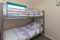 Second bedroom with space for cot or ready bed with fitted wardrobe