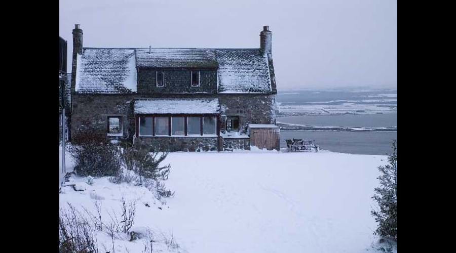 Farmhouse in the snow.