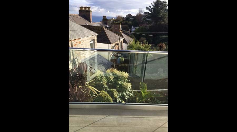 Relax out on our stylish newly installed glass balcony, toward Mounts Bay & tropical valley