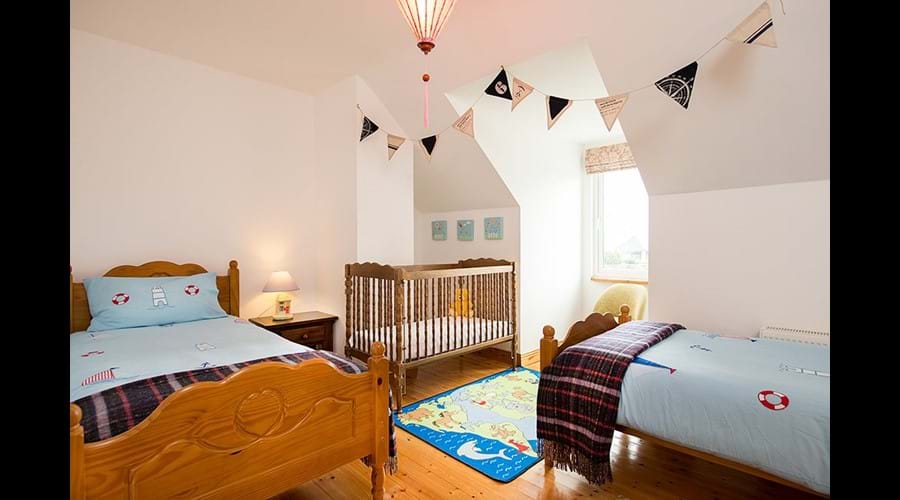 Bedroom 2...2 single beds and Cot...upstairs