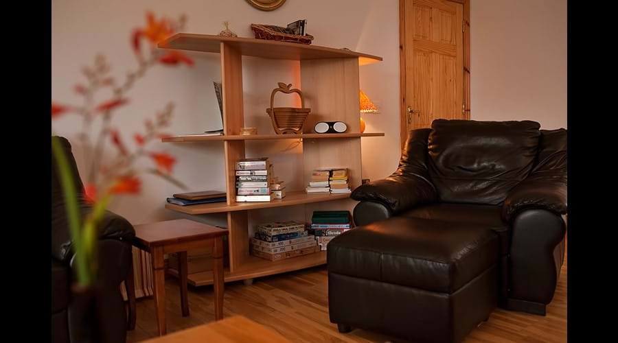 Relax with a good book in front of the open fire.