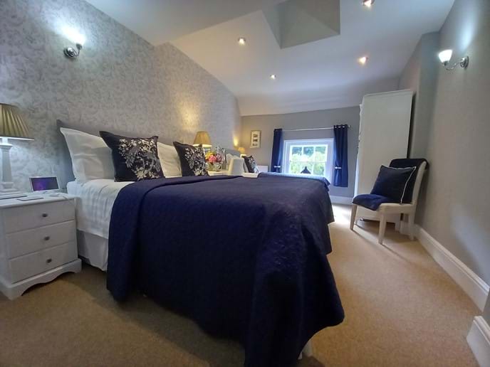 Beautiful decorated bedroom with King size bed & Single bed. View of the Iron Bridge from the window