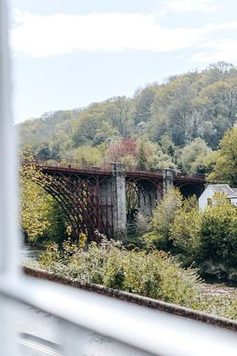 SIT BACK IN THE COSY LOUNGE AND ENJOY THE STUNNING VIEW OF THE FIRST IRON BRIDGE IN THE WORLD