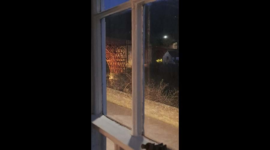Sit back on the sofa and enjoy the evening view of the Iron Bridge illuminated