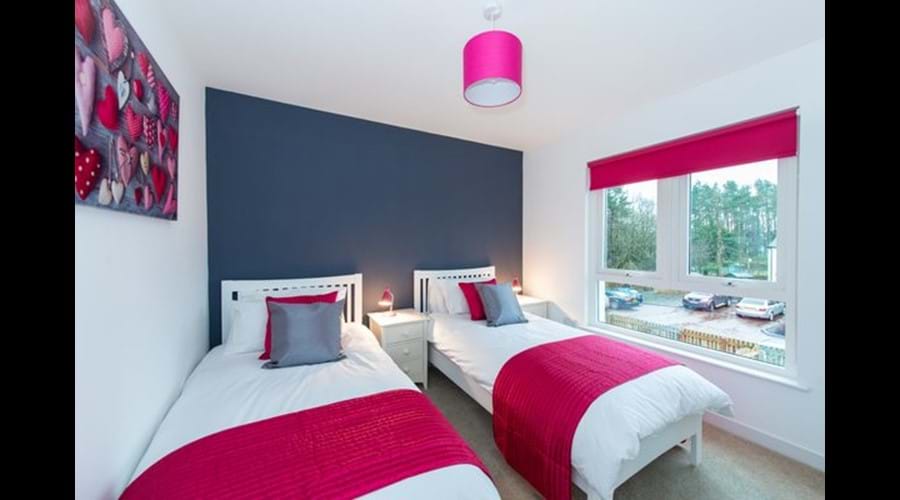 Modern and sunny twin bedroom overlooking rear garden