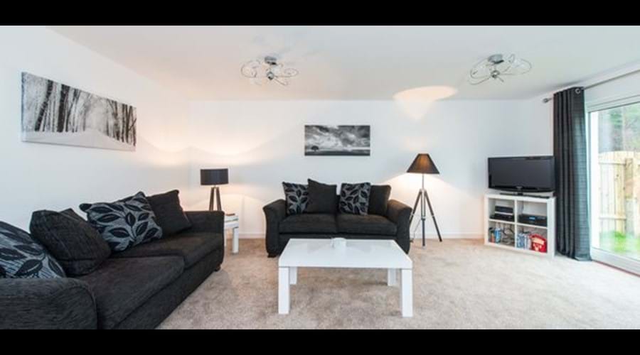 Spacious and airy living space with ample seating for six