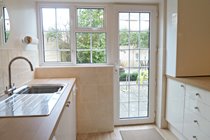 Newly fitted kitchen with direct access to rear garden.