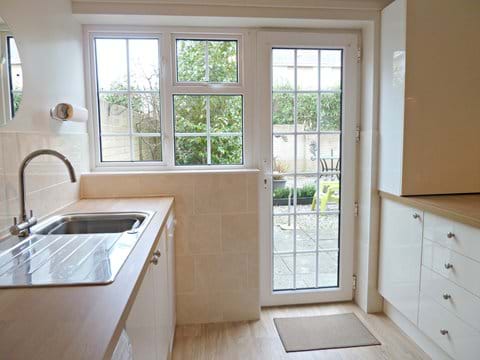Fully equipped, newly fitted kitchen - direct access to garden & rear gate.