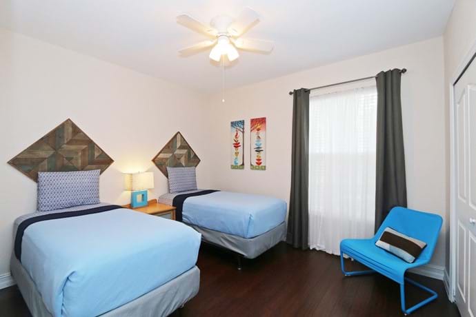 Bedroom 4 at 13-102 with large closet, ceiling fan and air con