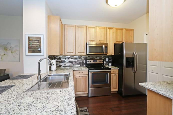 New Kitchen at 13-102 our 4 bedroom condo with solid maple wood cabinets & granite worktops