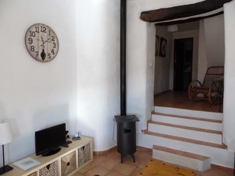 Log Burner and Steps up to another Seating Area.