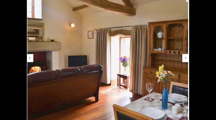 Open plan accommodation with beautiful wooden floor and vaulted beam ceilings