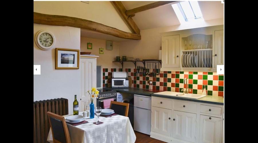 Well equipped kitchen and dining area