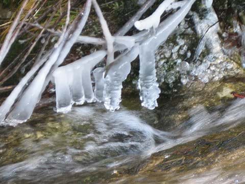 Icicles formed over running water