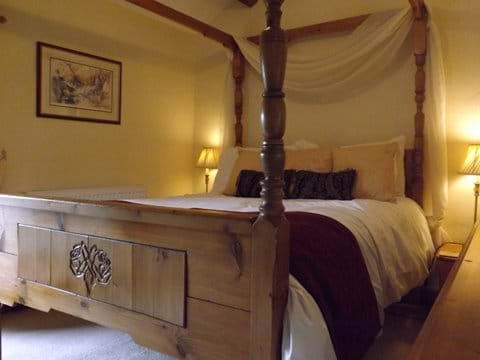 Bespoke hand carved four poster bed