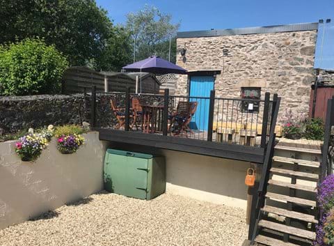 Two outside seating areas, raised mezzanine deck or sheltered stone barbecue area