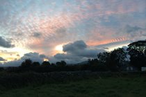 sunrise creeping up over the hills (Bothy in foreground)