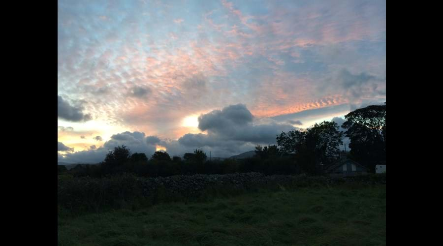 sunrise creeping up over the hills (Bothy in foreground)