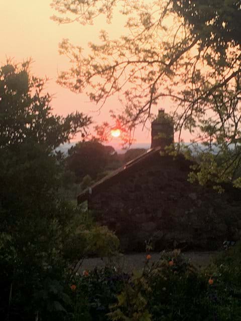 Sunset over the Bothy roof from the main house garden.