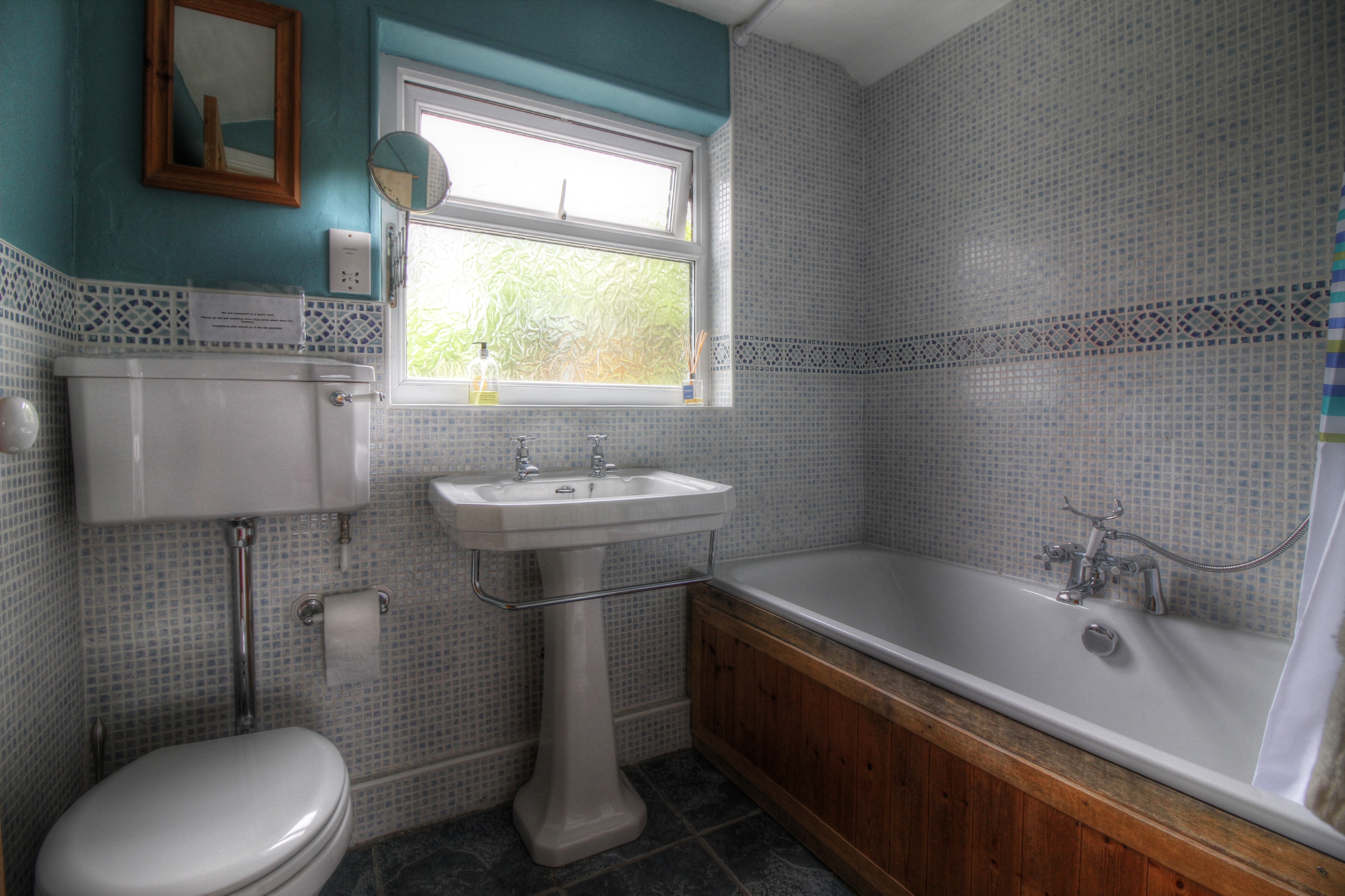 Family bathroom with double ended bath and over bath shower