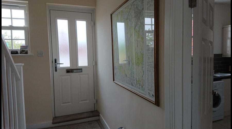 Welcoming hallway, coat hooks, shoe storage and a map of the New Forest to plan your days out.