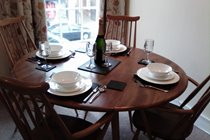 Quality bone china and modern cutlery, enjoy dining with a view of the High Street.